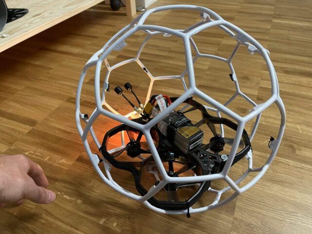 custom made drone in cage